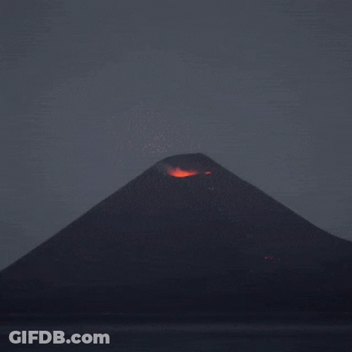 A Volcano Is Erupting With A Lot Of Flames GIF