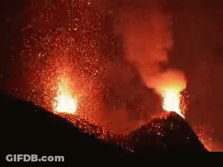 A Volcano With Lava Coming Out Of It 'S Mouth GIF