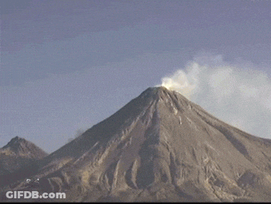 A Volcano With Smoke Coming Out Of It GIF