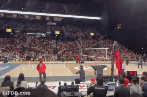 A Volleyball Game Is Being Played In A Stadium GIF