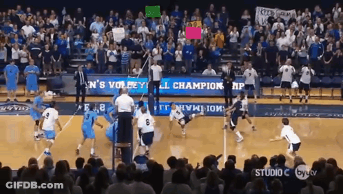 A Volleyball Game Is Being Played In Front Of A Crowd With A Banner That Says ' Men 'S Volleyball ' GIF