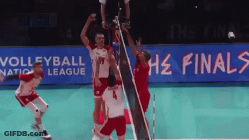 A Volleyball Game Is Being Played In Front Of A Sign That Says Volleyball Nation League GIF