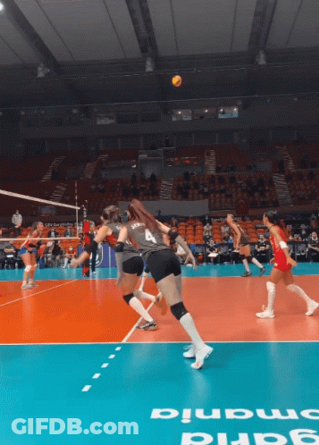 A Volleyball Game Is Being Played On A Court That Says ' Smania ' On The Floor GIF