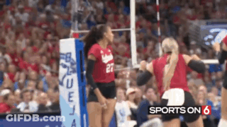 A Volleyball Player Wearing A Red Jersey With The Number 27 On It GIF