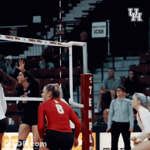 A Volleyball Player Wearing A Red Jersey With The Number 8 On The Back GIF