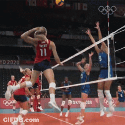 A Volleyball Player Wearing Number 11 Jumps In The Air GIF