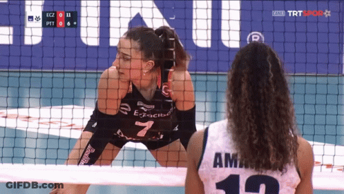 A Volleyball Player With The Number 7 On Her Jersey Stands Behind The Net GIF