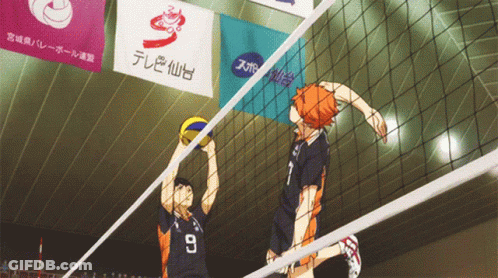 A Volleyball Player With The Number 7 On His Jersey Jumps To Block A Ball GIF
