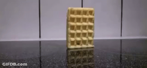 A Waffle Bar Is Sitting On A Black Counter . GIF