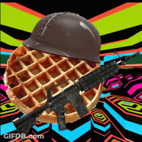 A Waffle With A Helmet And An Assault Rifle On It GIF