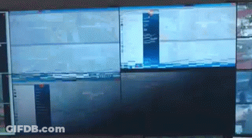 A Wall Of Monitors With One That Says ' Nbc ' On The Bottom GIF