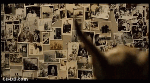 A Wall With A Lot Of Pictures On It And One Of Them Says ' A ' On It GIF