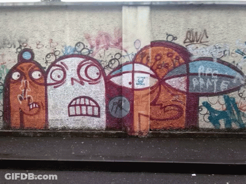 A Wall With Graffiti On It Including A Sticker That Says ' A Few Boys ' GIF