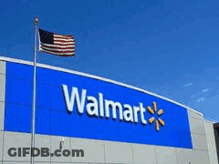 A Walmart Store With People Standing Outside In Front Of It GIF
