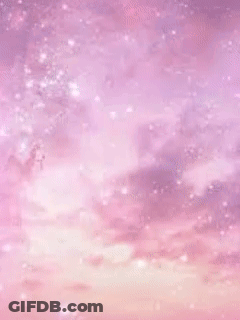 A Wand With A Crescent Moon On It Against A Pink Sky GIF