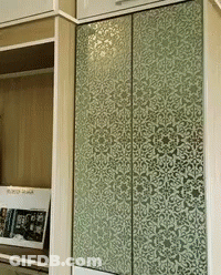 A Wardrobe With A Floral Pattern On The Door GIF