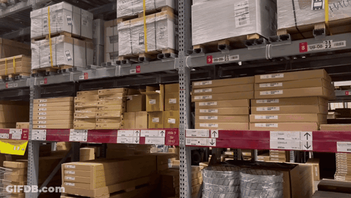 A Warehouse Filled With Lots Of Boxes Including One That Says ' Ikea ' GIF