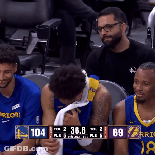 A Warriors Player Wipes His Face With A Towel During A Game GIF