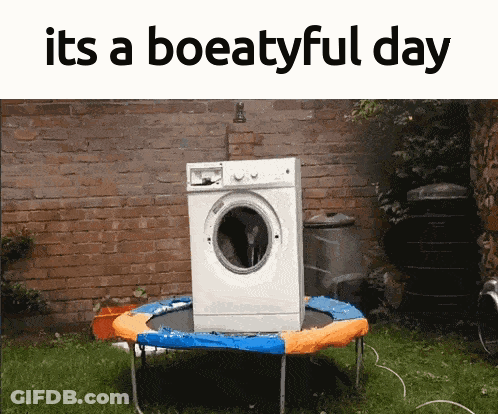 A Washing Machine Sitting On Top Of A Trampoline With The Words " Its A Boeatyful Day " Above It GIF