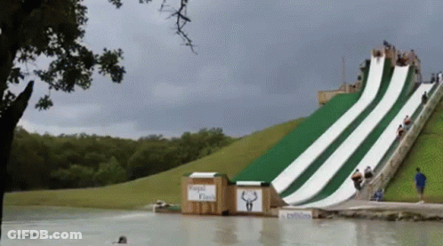 A Water Slide Has A Sign That Says Rapid Flash GIF
