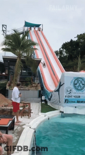 A Water Slide With A Sign That Says " Fight Your Fear " GIF