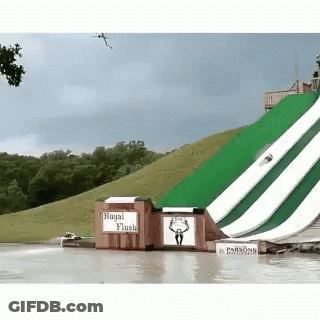 A Water Slide With A Sign That Says " Royal Flush " GIF