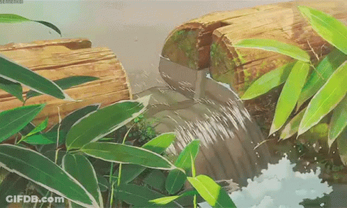 A Waterfall Is Coming Out Of A Log In The Woods GIF