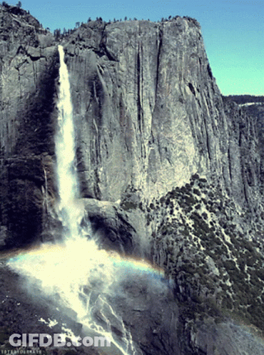 A Waterfall With A Rainbow In The Foreground And The Word Yosemite On The Bottom GIF