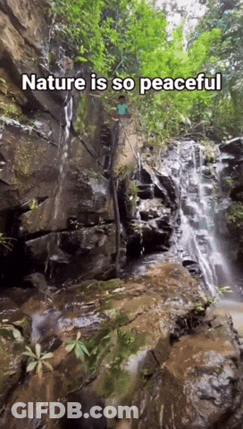A Waterfall With The Words Nature Is So Peaceful GIF