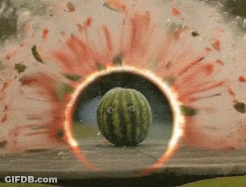 A Watermelon Is Surrounded By A Circle Of Fire GIF