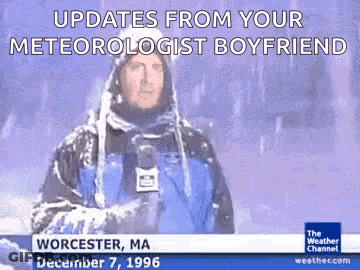 A Weatherman Is Standing In The Snow With A Microphone In His Hand And Says Updates From Your Meteorologist Boyfriend . GIF