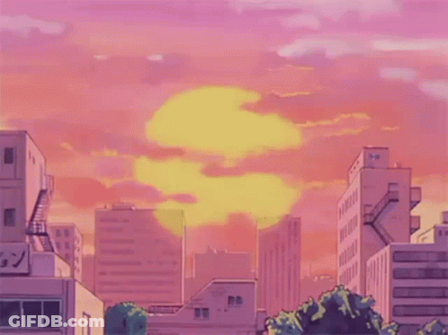 A Welcome Sign With A Sunset In The Background And Buildings In The Foreground GIF