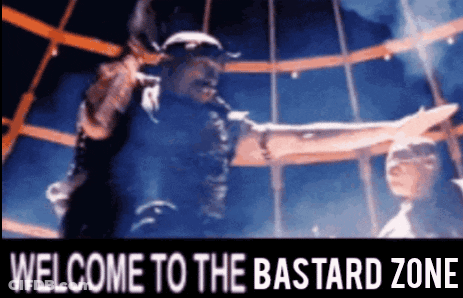 A Welcome To The Bastard Zone Sign With A Man In A Helmet GIF