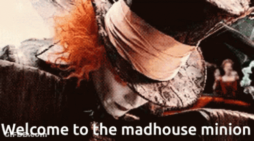 A Welcome To The Madhouse Minion Sign With A Picture Of Mad Hatter GIF