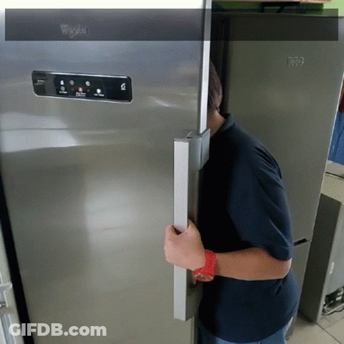 A Whirlpool Refrigerator Is Being Opened By A Man GIF