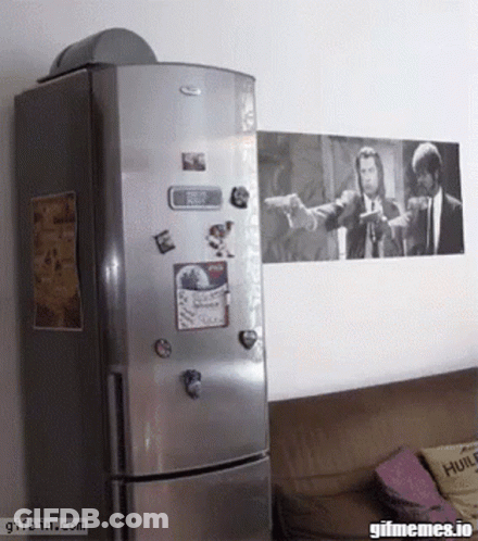 A Whirlpool Refrigerator With A Picture Of Pulp Fiction On The Wall GIF