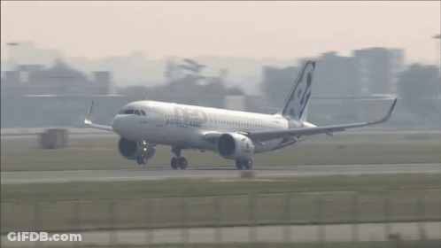 A White Airbus A320 Is Taking Off From An Airport GIF