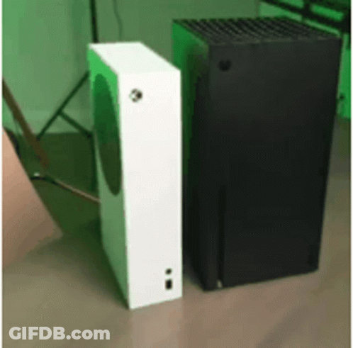 A White And A Black Box Are Sitting Next To Each Other On A Wooden Floor . GIF