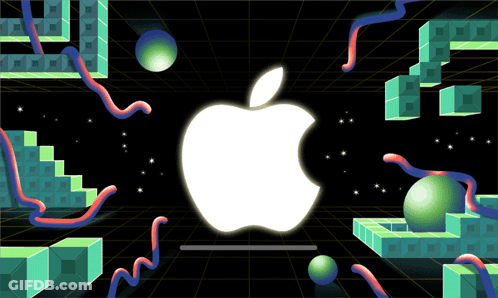 A White Apple Logo Is Surrounded By Green Cubes And Balls GIF