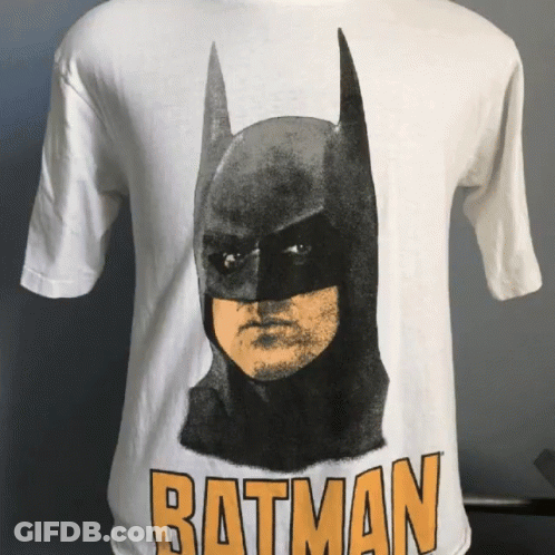 A White Batman T-Shirt With A Picture Of Batman On It GIF