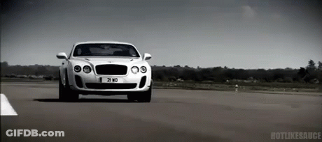 A White Bentley Is Driving Down A Road With A License Plate That Says 21 Md GIF