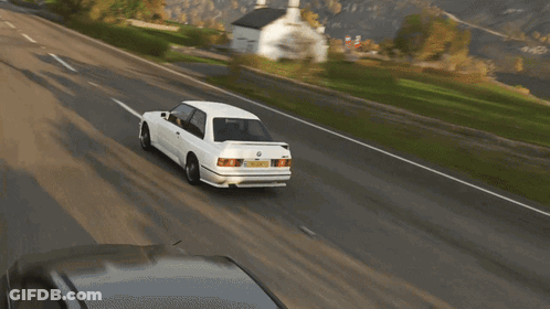 A White Bmw Is Driving Down A Road With A Yellow License Plate That Says ' Aoc ' On It GIF