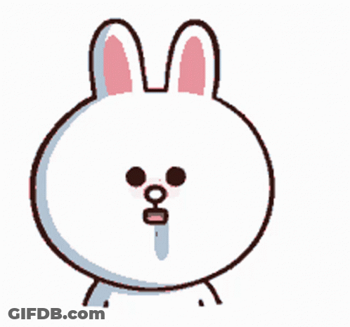 A White Bunny With Pink Ears And Black Eyes Looks At The Camera GIF