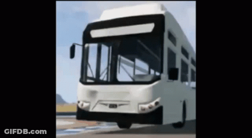 A White Bus Is Driving Down A Road GIF