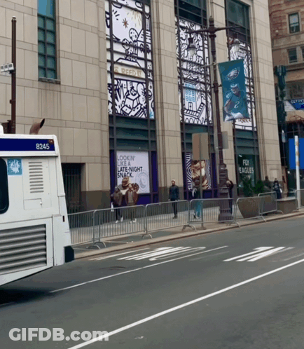 A White Bus With The Number 8245 On The Back GIF