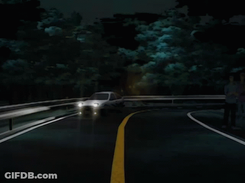 A White Car Is Driving Down A Dark Road GIF