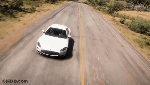 A White Car Is Driving Down A Road With Trees In The Background GIF