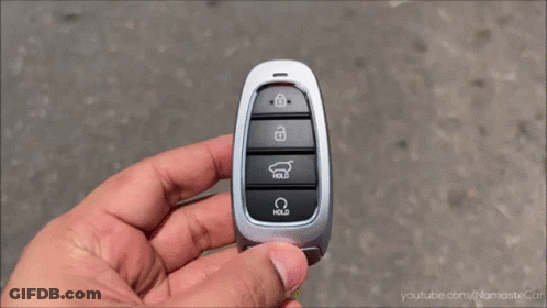 A White Car Is Driving Down A Street With A License Plate That Says ' Shree Ram ' On It GIF