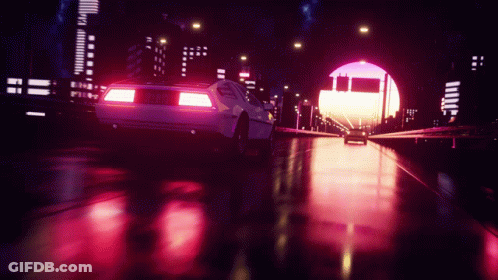 A White Car Is Driving Through A Tunnel With A Sunset In The Background GIF