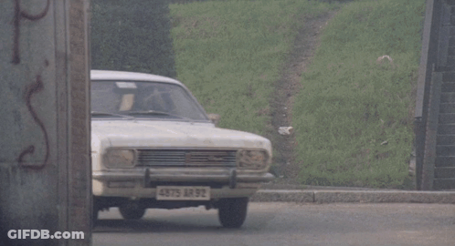 A White Car With 4875 Ar 92 On The Front License Plate GIF